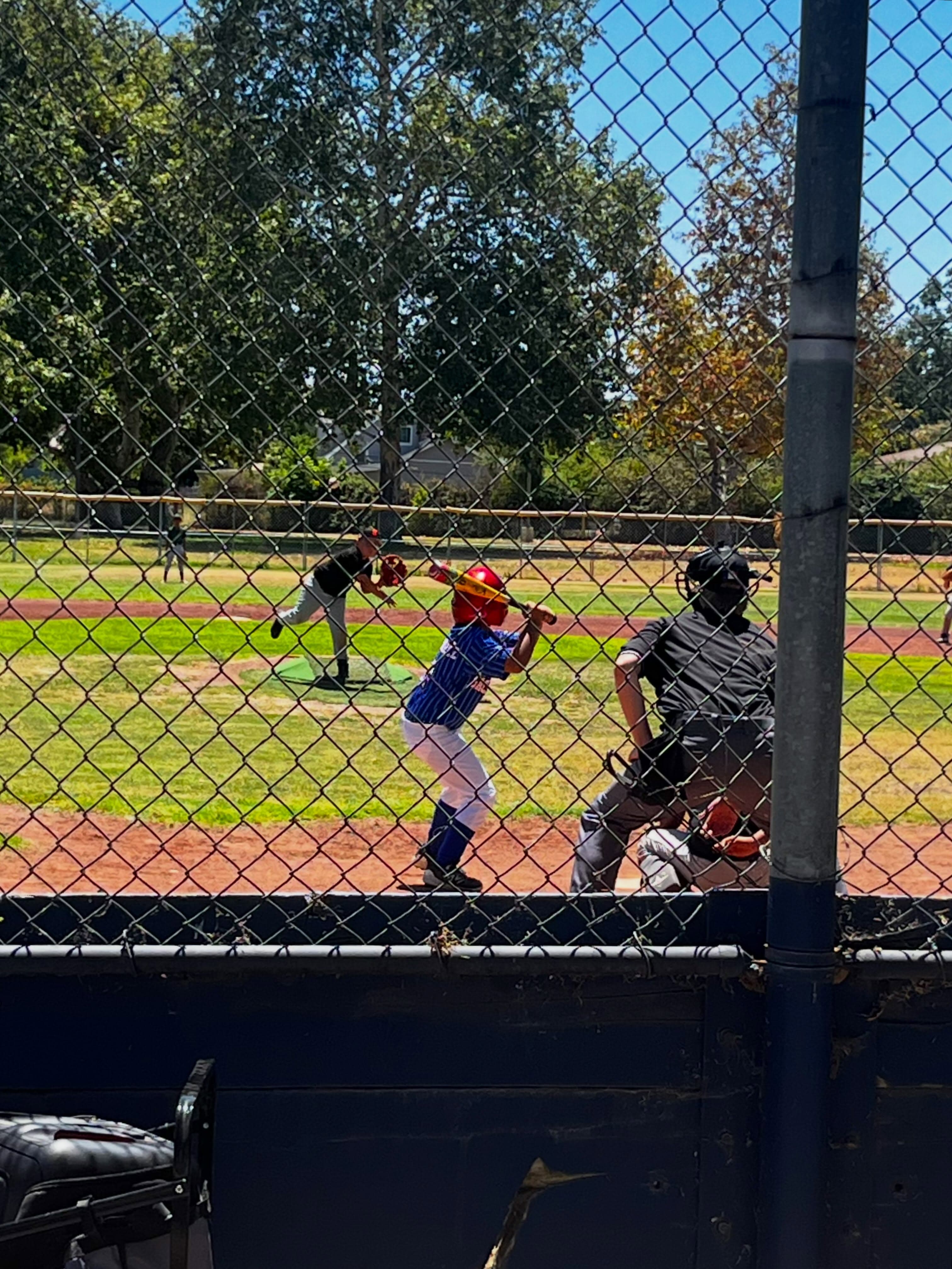 A Stars hitter waits on a pitch while the umpire stands behind the plate.